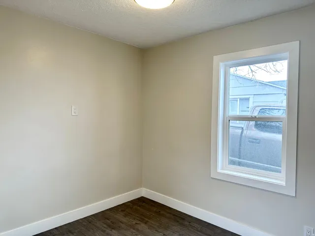 Neutral-toned walls paired with wood-finish flooring