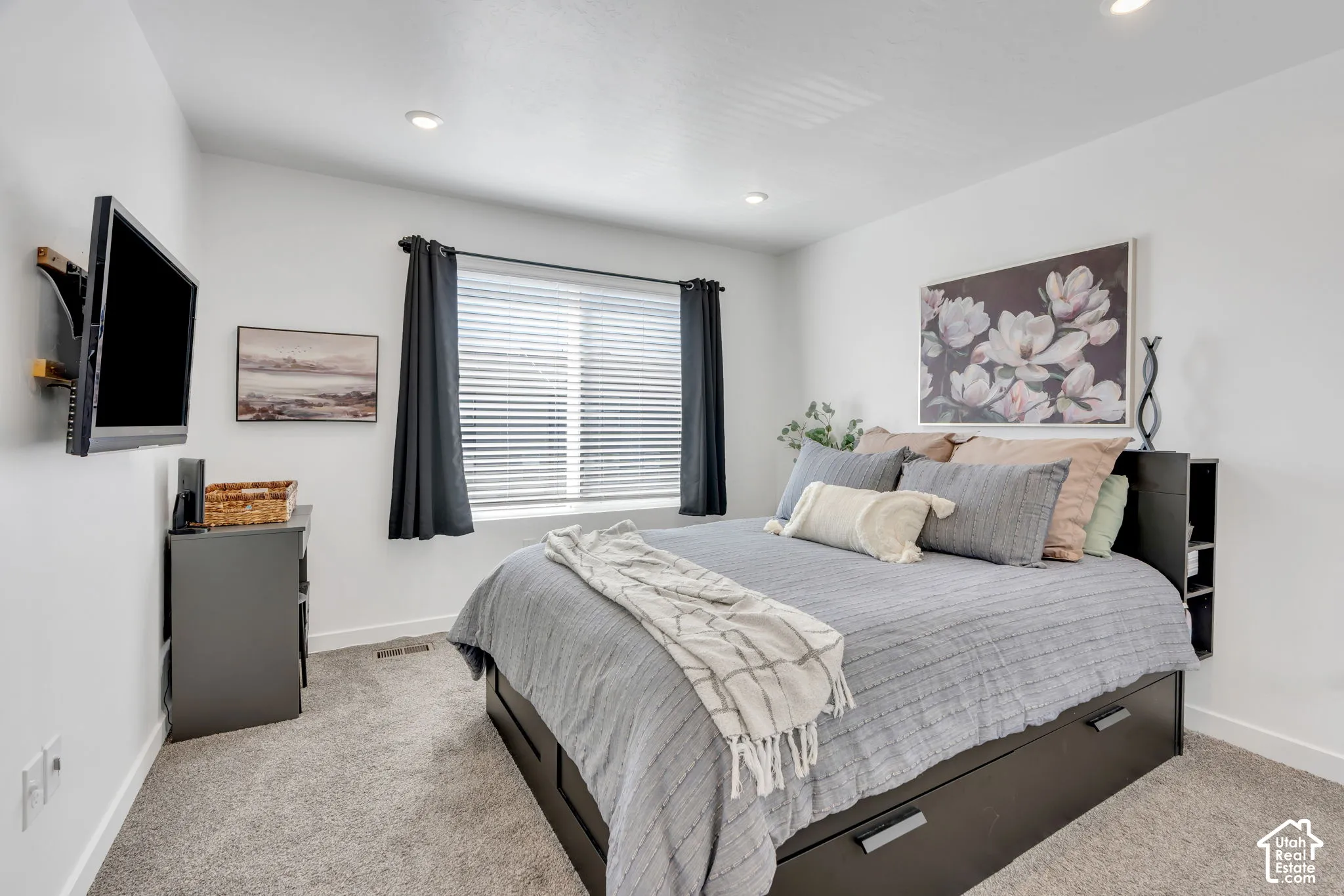 Carpeted flooring, recessed lighting, and a window with blinds