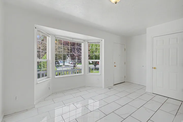 Bay window with multiple panes overlooking exterior landscaping