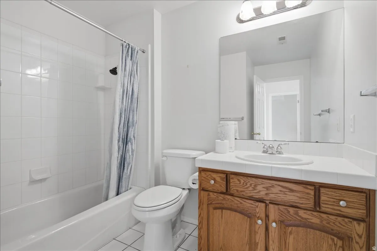 Bathroom featuring a full-size tub with white subway tile surround