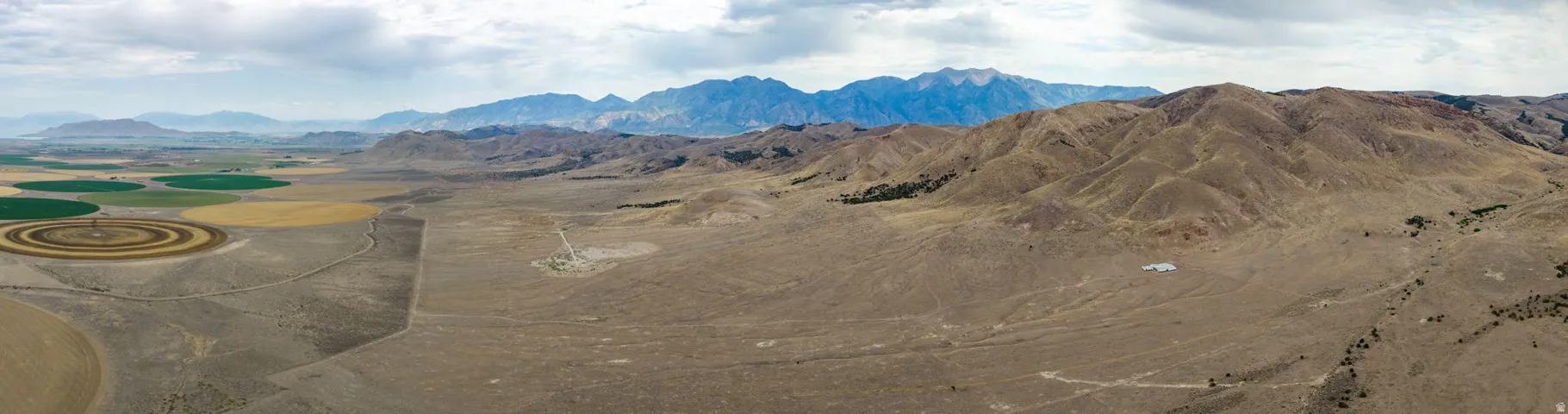 Expansive land parcel featuring diverse topography with flat and rolling terrain