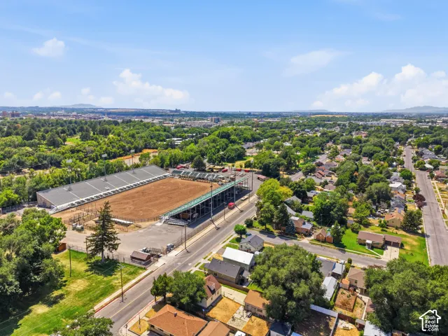 Aerial perspective showcasing a sprawling equestrian arena with spectator seating