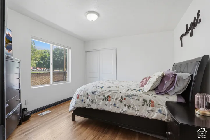 Bright interior with wood-finish flooring and a white color palette
