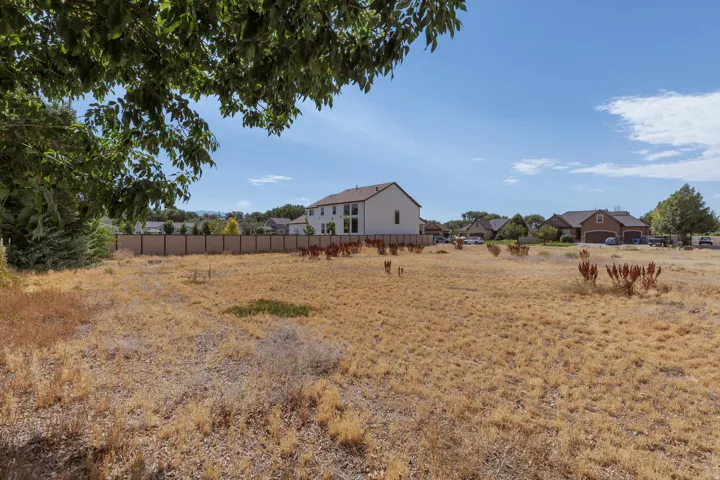 Expansive undeveloped lot featuring a perimeter fence