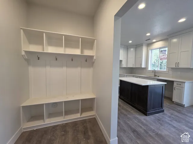 Built-in mudroom storage with hooks and cubbies