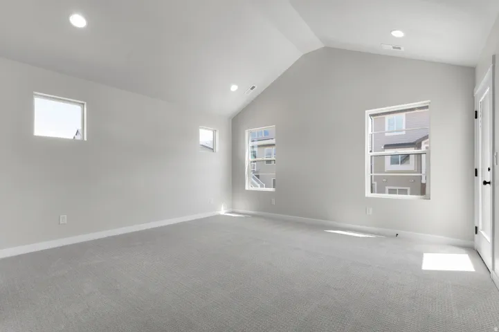 Vaulted ceilings complementing gray wall finishes