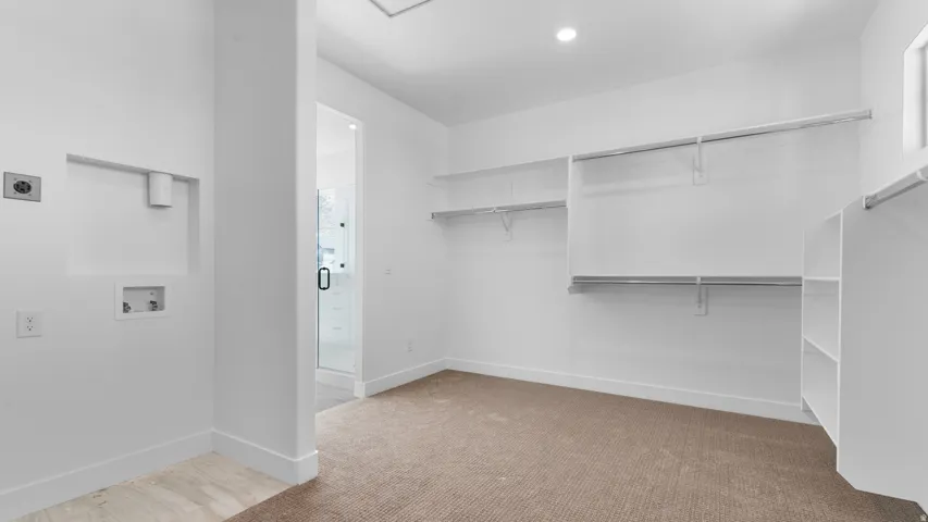 Walk-in closet with integrated shelving and hanging rods