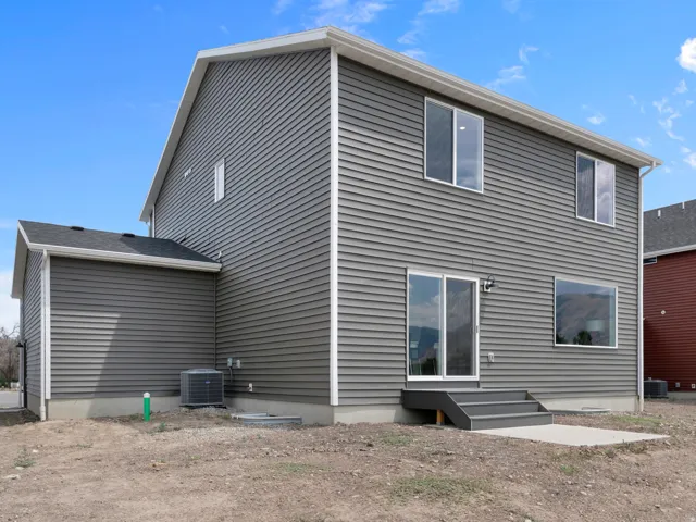 Two-story residence featuring gray horizontal siding and white trim