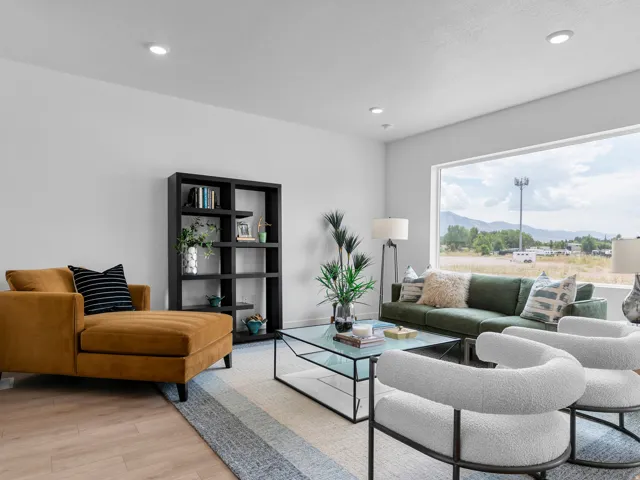 Spacious interior with recessed lighting and light wood-finish flooring