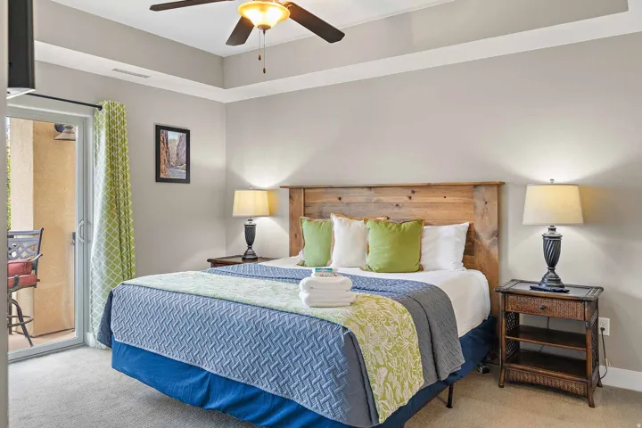 Bedroom featuring a tray ceiling, recessed lighting, and a ceiling fan