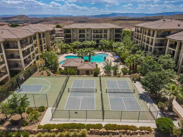 Aerial view of multi-story buildings surrounding a central recreational area