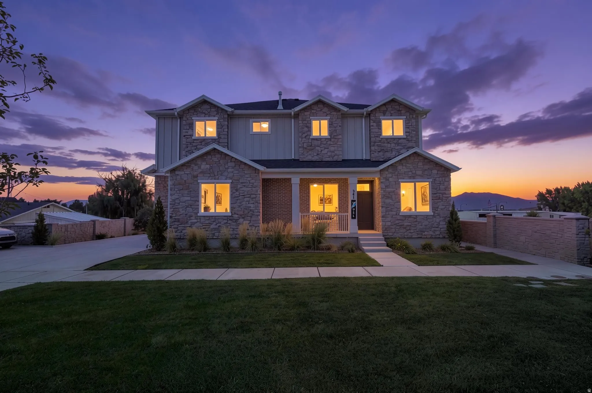 Stone and siding exterior with gabled dormers
