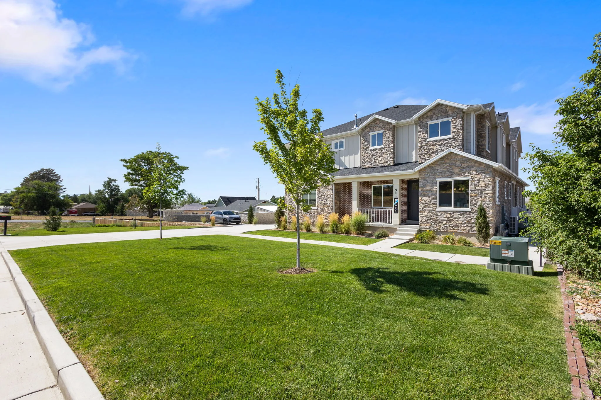 Stone and siding exterior with a covered front porch