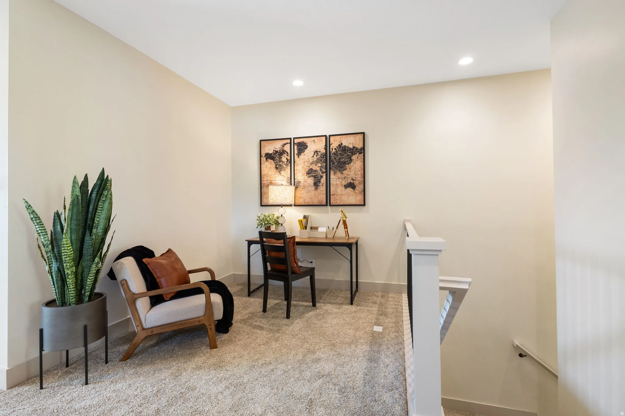 Carpeted loft area featuring recessed lighting, painted walls, and a white railing system