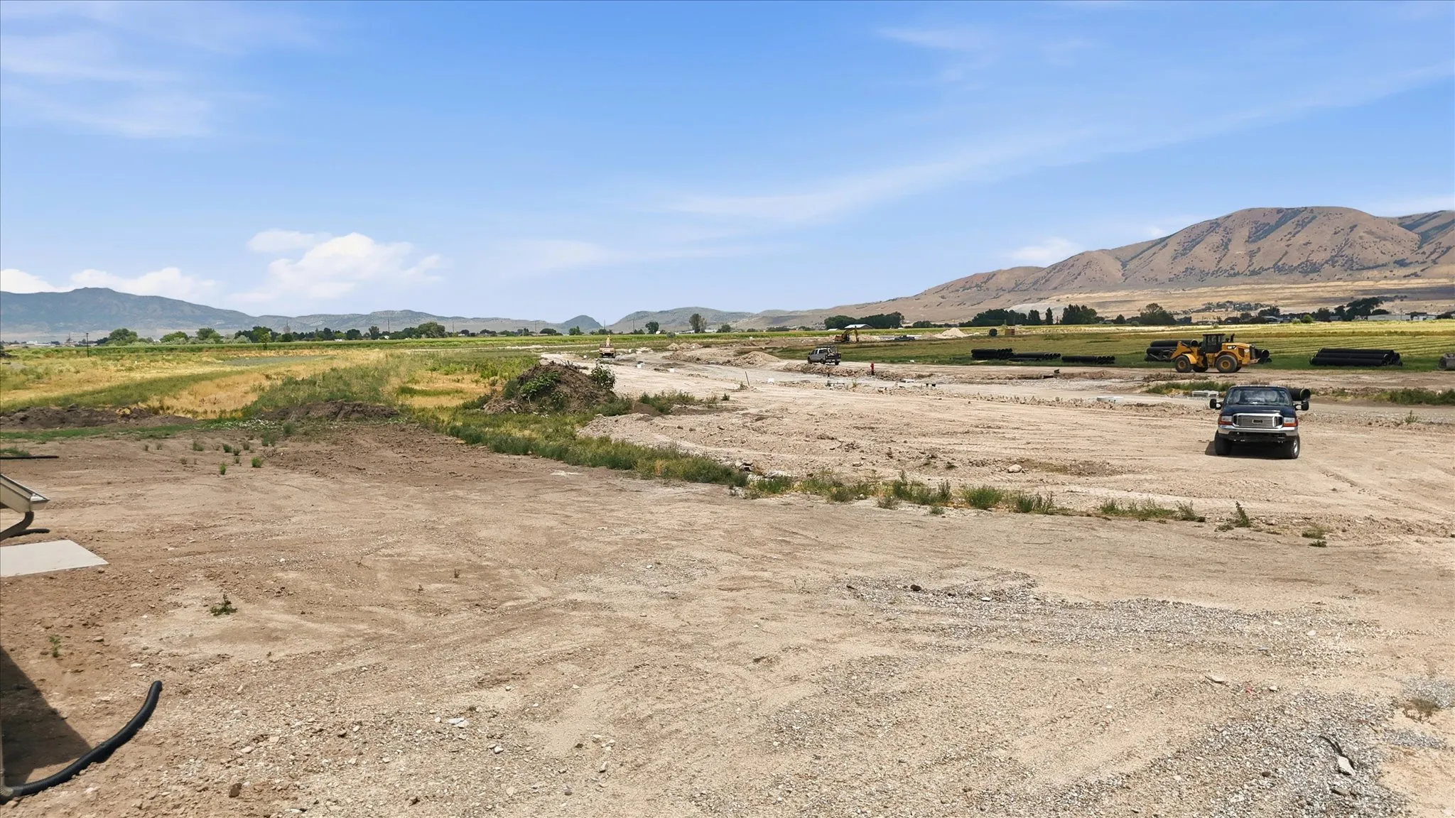 Expansive land featuring a broad, flat expanse of earth