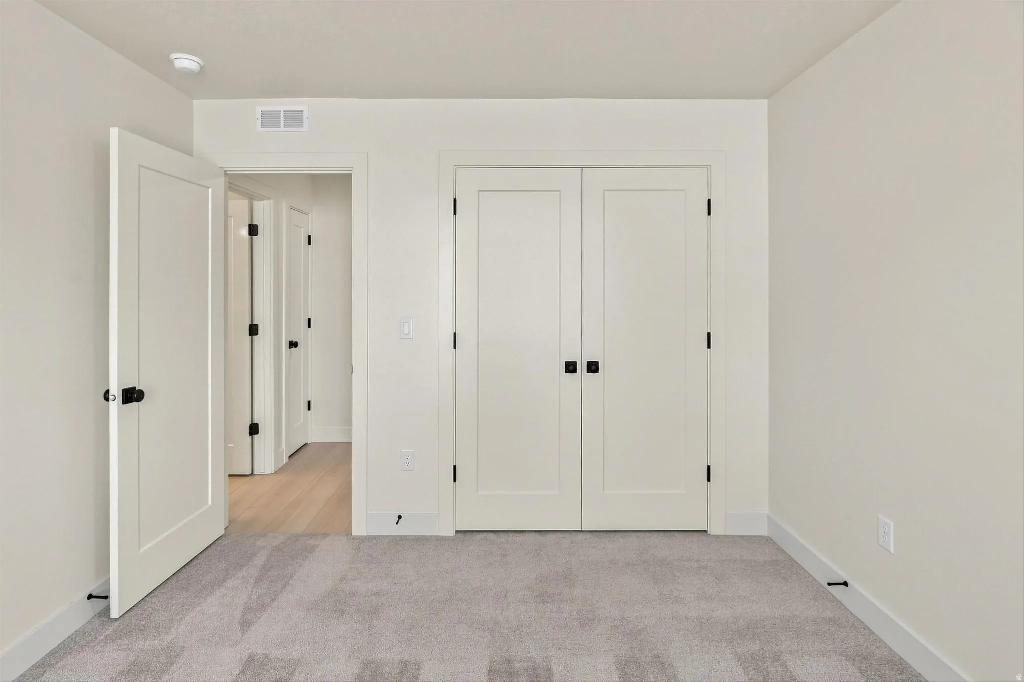 Light gray carpeting and neutral wall tones