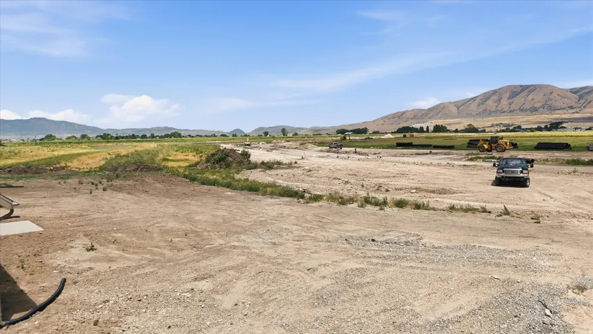 Expansive land featuring a broad, flat expanse of earth