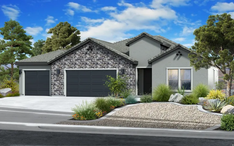 Contemporary stucco and stone-clad exterior with a multi-gabled roofline