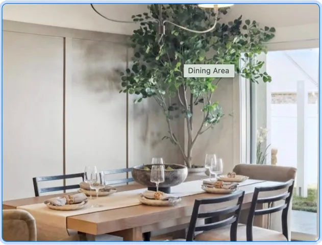 Dining area featuring a wood-finish table, a contemporary light fixture, and a large window