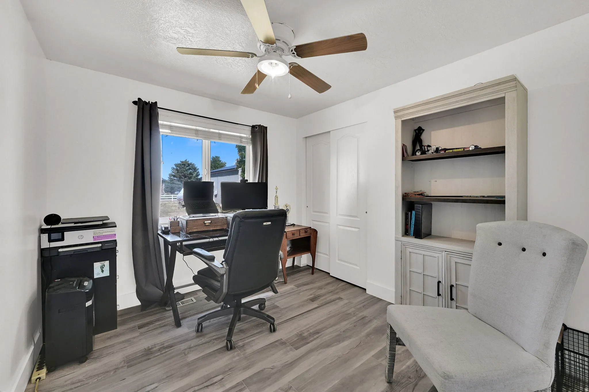 Neutral white wall paint with wood-finish flooring