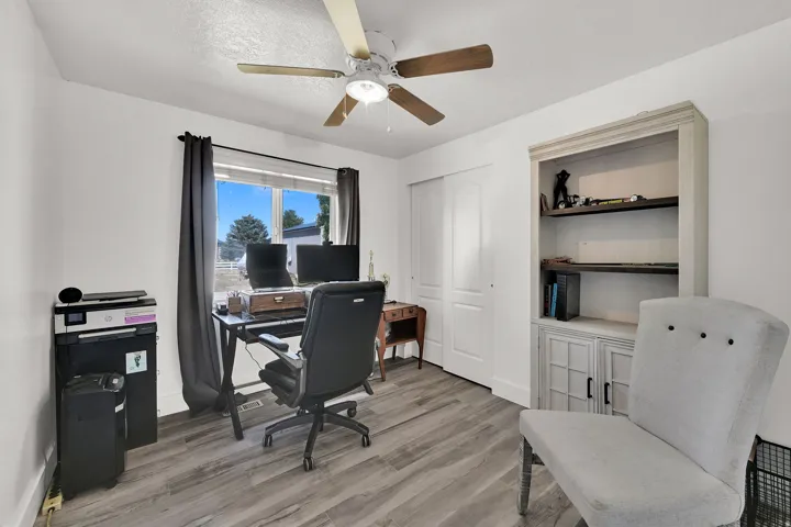 Neutral white wall paint with wood-finish flooring