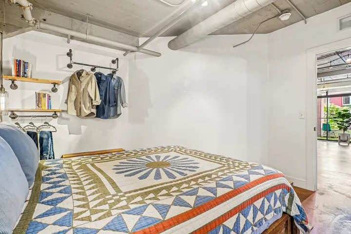 Industrial-style open shelving and clothing rack system