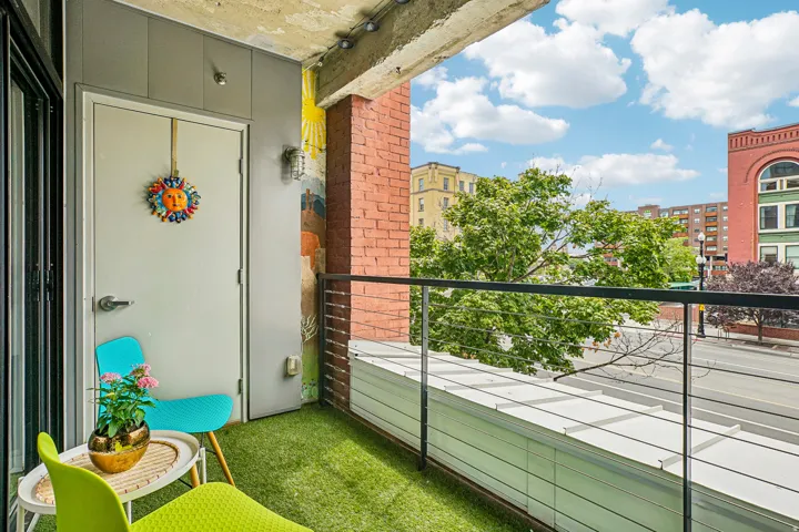Private balcony with faux turf flooring