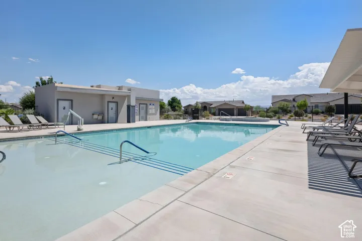 Expansive community swimming pool featuring integrated steps and handrails
