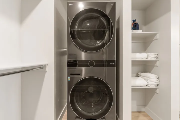 Stacked LG washer and dryer unit, integrated into a closet space