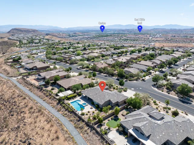 Expansive property featuring a private swimming pool, integrated spa, and desert-inspired landscaping