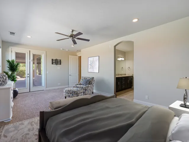Carpeted room featuring French doors, recessed lighting, and a ceiling fan