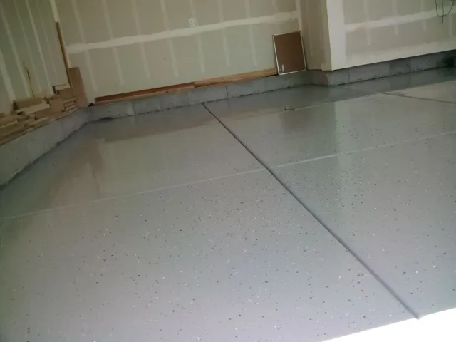Epoxy-coated concrete flooring with a speckled finish