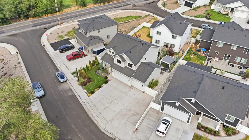 Contemporary single-family home featuring a multi-gable roofline and an attached two-car garage
