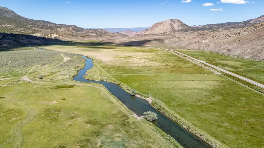 Expansive green landscape with a winding river