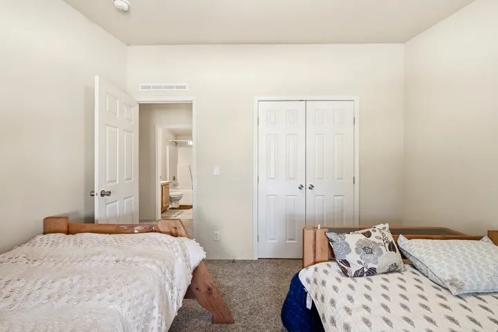 Neutral wall paint with textured carpet flooring