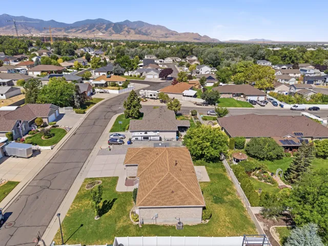 Aerial perspective showcasing a residential neighborhood with mountain scenery