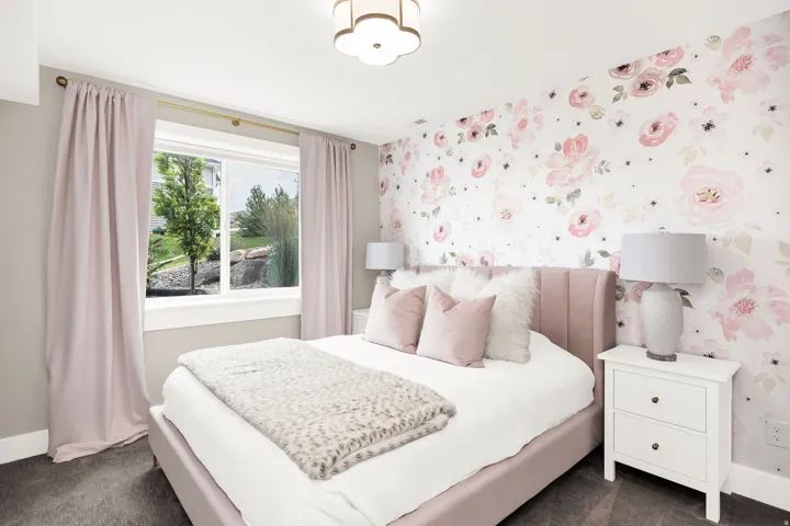 Bedroom featuring a large picture window, patterned accent wall, and recessed ceiling light fixture