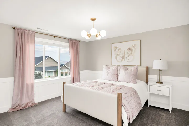 Room featuring wainscoting, a gold-toned chandelier, and a large window