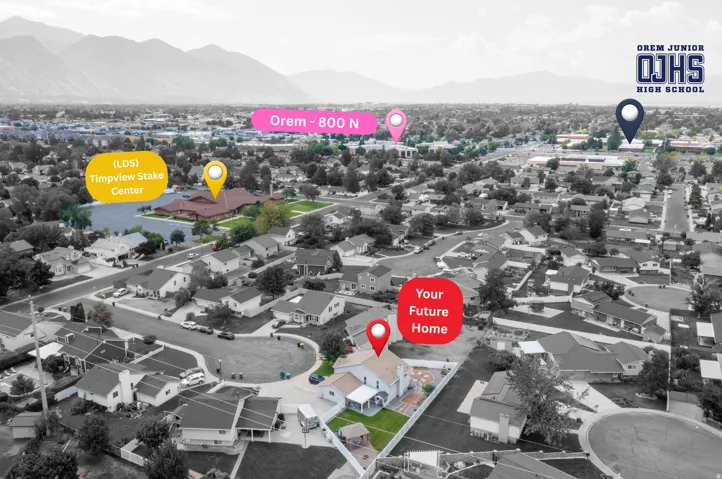 Aerial perspective showcasing a residential neighborhood with mountain backdrops