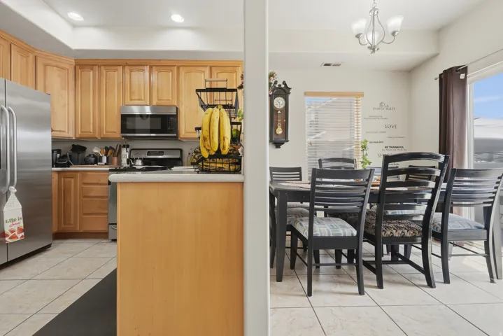 Kitchen featuring light wood cabinetry and stainless steel appliances