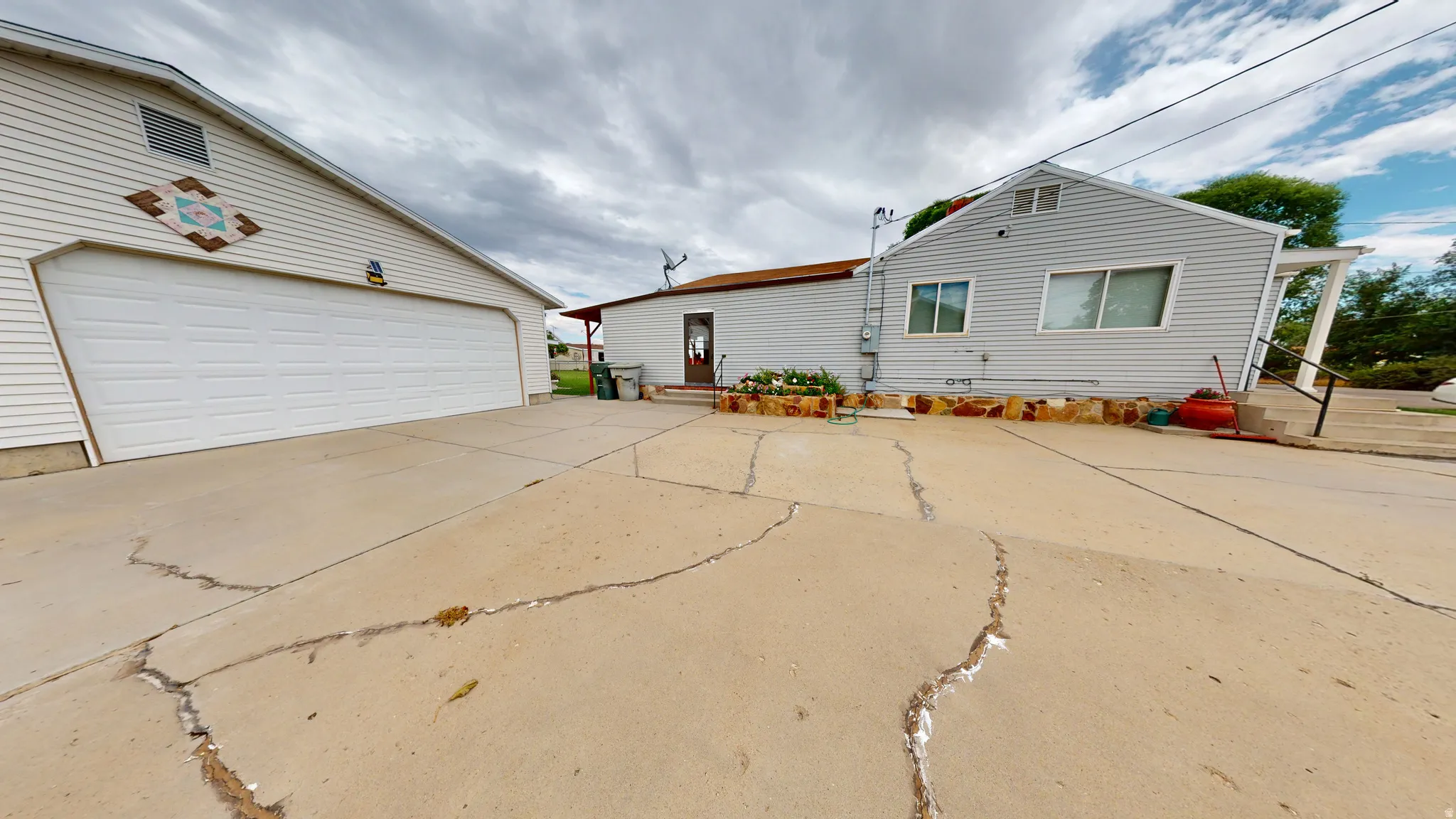 Detached two-car garage with white paneled door
