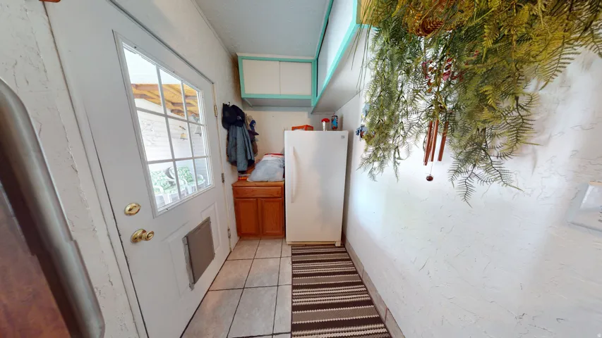 White paneled exterior door with divided light window