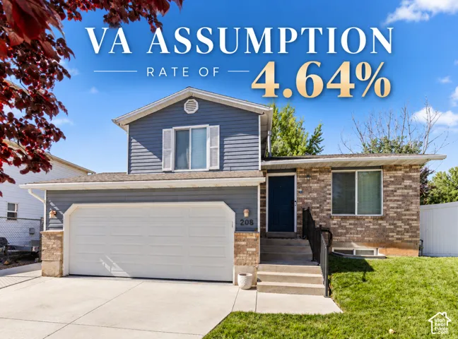 Two-story exterior featuring horizontal siding, brick veneer accents, a double-car garage, and concrete steps with metal handrails