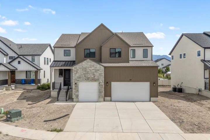 Contemporary exterior with stone facade accents and horizontal siding