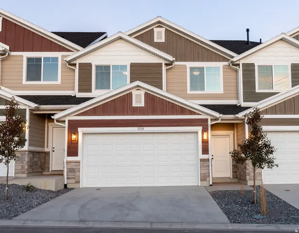 Modern multi-story townhome with a two-car garage