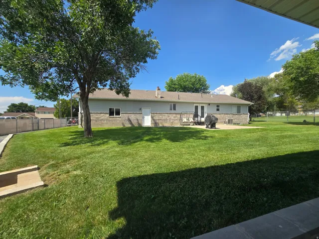 Expansive green lawn with mature trees