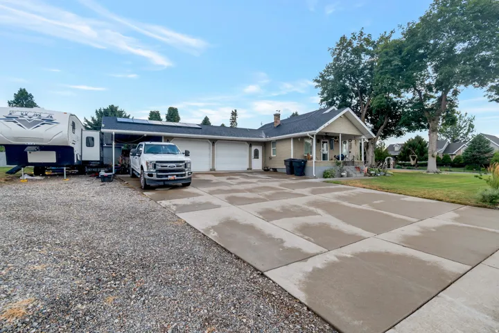 Spacious concrete driveway and attached two-car garage