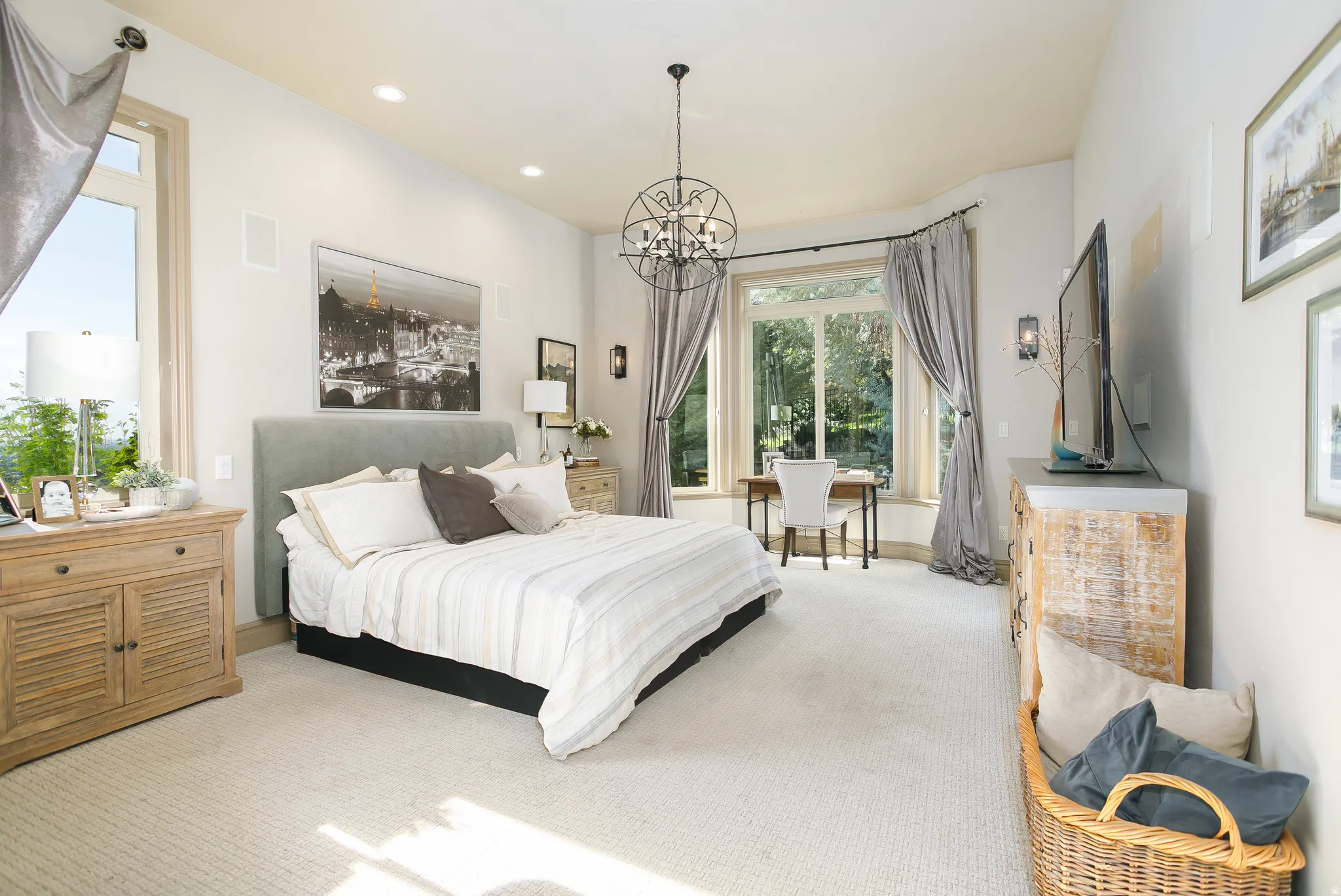 Carpeted interior with high ceilings and recessed lighting