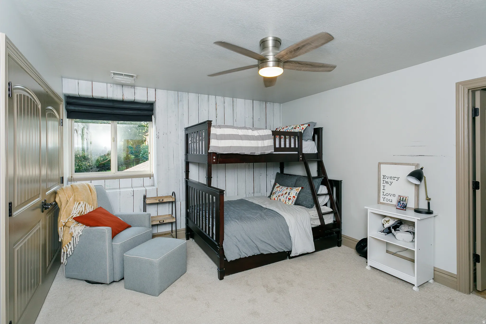 Interior room featuring light-toned carpeting and neutral wall paint