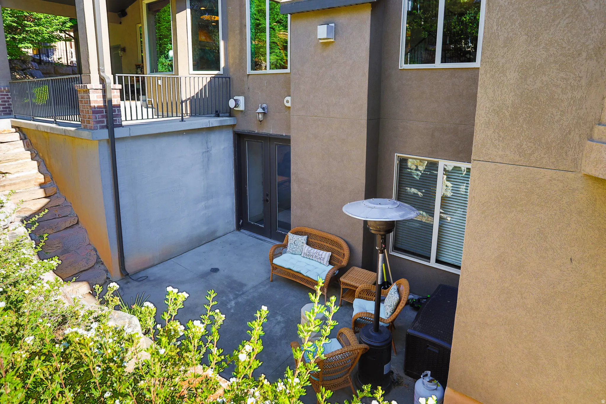 Lower-level patio featuring concrete surfacing and direct outdoor access